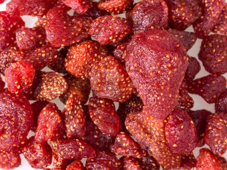 Closeup dried strawberry bake with honey on white background