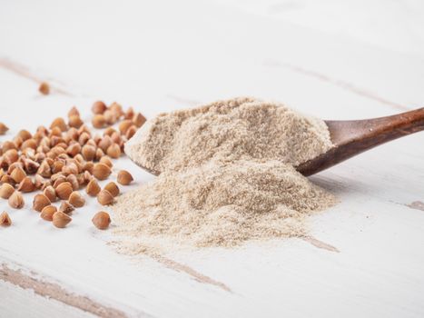 Buckwheat flour and buckwheat on white background Copy space.