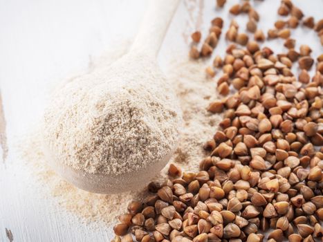 Buckwheat flour and buckwheat on white background Copy space.