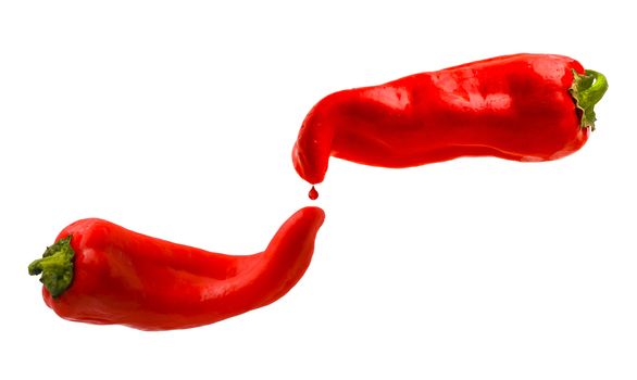 Red peppers with red drop isolated on a white background