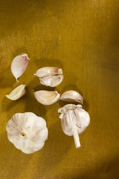 Ripe fresh garlic on a brown wooden table