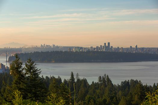 City skyline view of Vancouver and Burnaby by Stanley Park during sunrise
