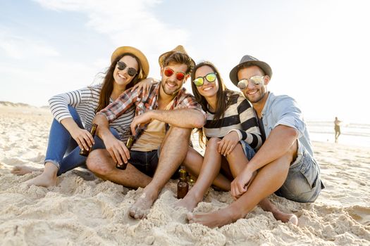 Friends at the beach enjoying the summer