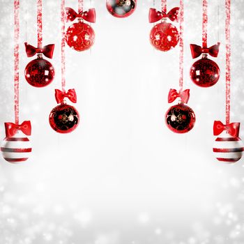 Red Christmas balls hanging on red ribbons on white background