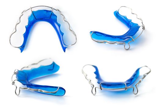 collection of retainer orthodontic equipment on white background