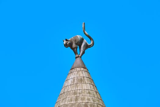 Sculpture of the Angry-looking Cat on Turret Rooftop. Riga, Latvia