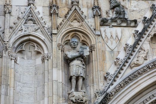 stone carving of a knight on York Minster wall