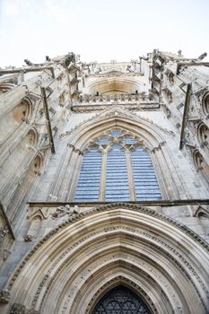 magnificently carved stone frontispiece to a cathedral with arch and window