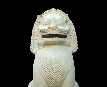 White lion statue with a black background.