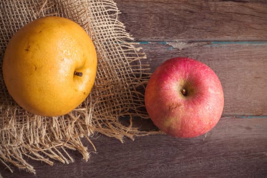 pear and apple  on old wooden table.