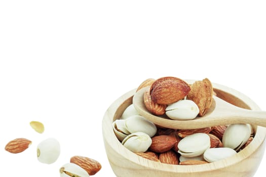 Almond in a bowl on white background.