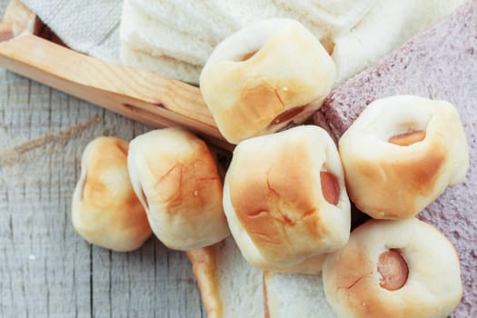 Bread filled on a wooden floor.