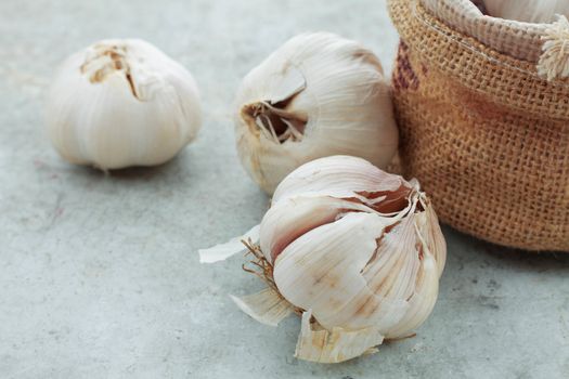 Garlic on the floor and sack.