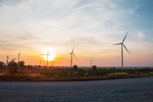 wind farm with sun is rising in the morning.