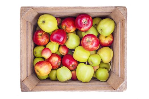 Fresh apples in a wooden box isolated on white background