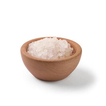 Sea salt in wooden bowl on white background with clipping path.