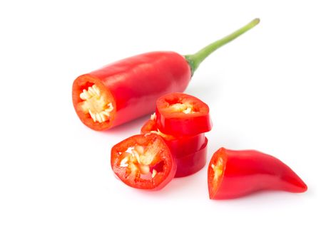 Closeup red chili pepper with sliced on white background, raw food ingredient concept