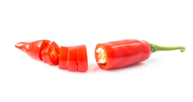 Closeup top view red chili pepper with sliced on white background, raw food ingredient concept