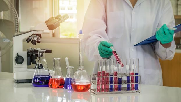 scientist with equipment and science experiments in laboratory