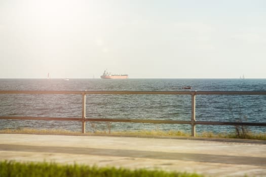 Seafront promenade with views of ships 