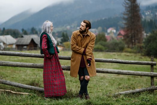 pair of lovers in the Carpathian mountains in national costumes