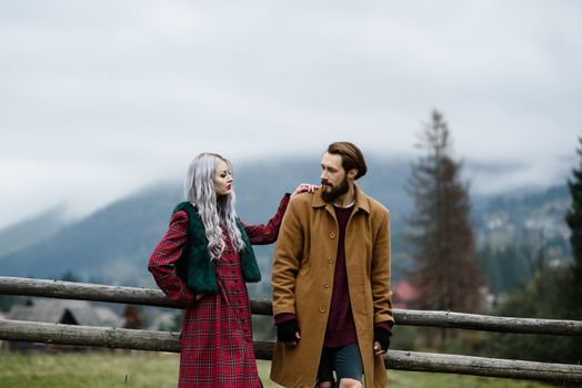 pair of lovers in the Carpathian mountains in national costumes