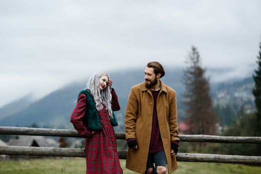 pair of lovers in the Carpathian mountains in national costumes