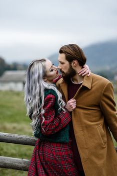 pair of lovers in the Carpathian mountains in national costumes