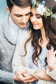 Сouple of newlyweds in the Carpathian waterfall, a wedding walk