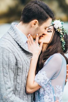 Сouple of newlyweds in the Carpathian waterfall, a wedding walk