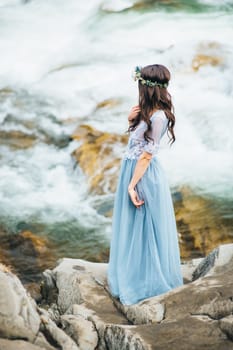 Сouple of newlyweds in the Carpathian waterfall, a wedding walk