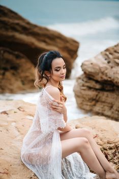 young girl bride in her underwear on the shore of the sea dreams of the future