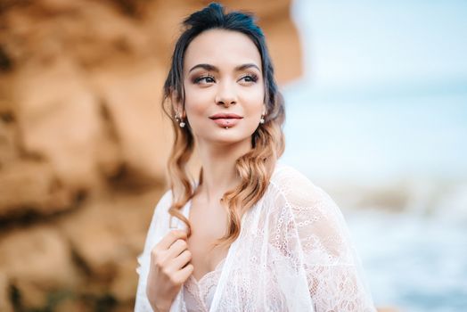 young girl bride in her underwear on the shore of the sea dreams of the future