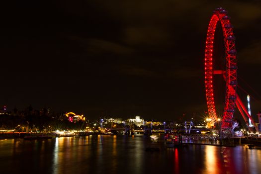 Landscape of the London eye and Thames river at night from Westminster bridge