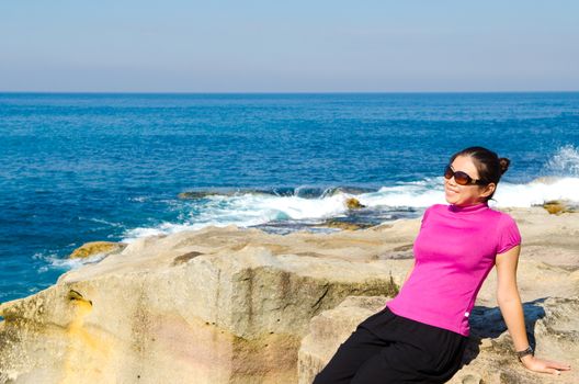 Asian girl explores the coastline of Bondi Beach in Sydney,Australia.