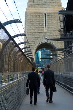 People walking on the popular pedestrian walkway on the Sydney Harbour Bridge in Australia