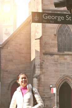 Girl walking at George Street in Sydney New South Wales, Australia