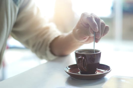 Closeup of male hands holding coffee