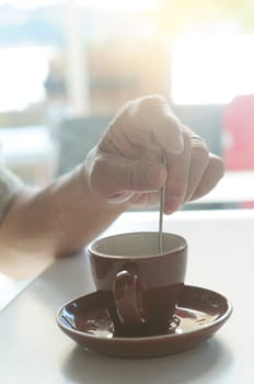 Closeup of male hands holding coffee