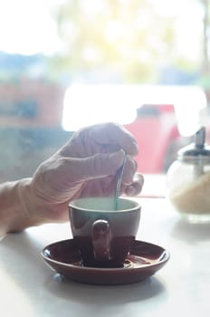 Closeup of male hands holding coffee