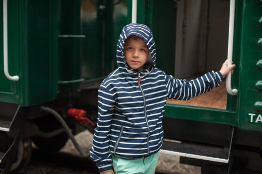 Adorable boy on a railway station