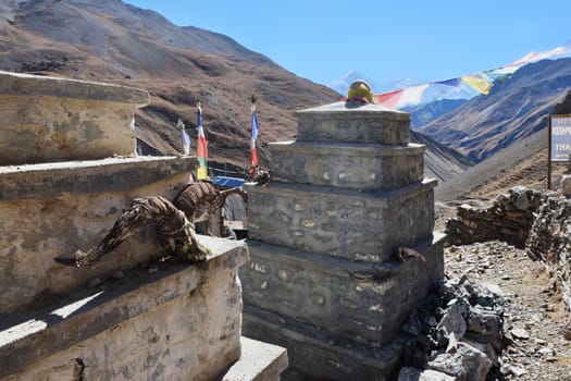 Buddhist monuments high in the mountains near annapurna trek lodge - base camp