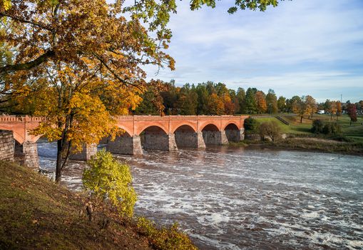 Brick bridge on the background of the autumn landscape,Reldiga,Latvia