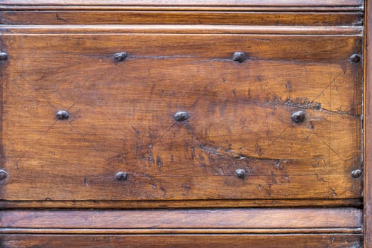 Close up of rustic old door in Spoleto, Italy.