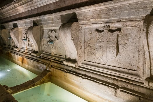 detail of an ancient fountain in Assisi (Italy)