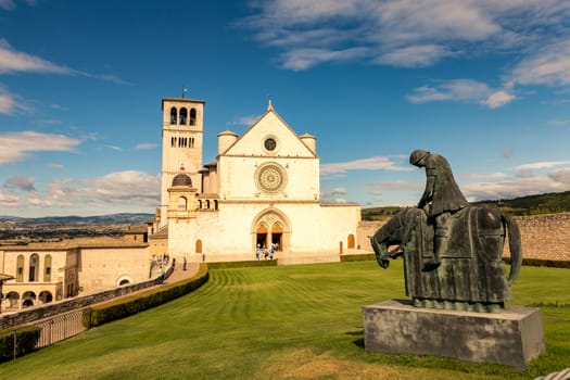 St. Francis of Assisi Church with the statue of St. Francis on a horse in the foreground. St. Francis is the patron saint of Italy. The bell tower can be seen from miles away.