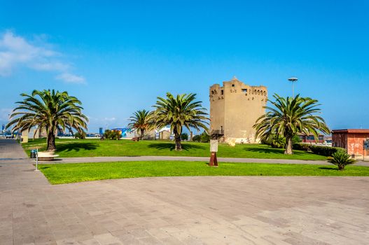 View of Aragonese tower in Porto Torres harbour in a sunny day - Sardinia