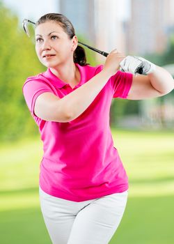 Pose woman golfer after hitting a ball club on a background of golf courses