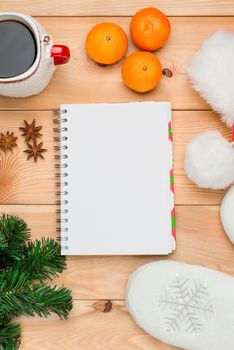 tangerines, christmas tree branch and notepad close-up