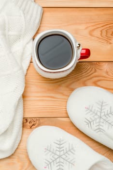 hot coffee and warm clothes on wooden boards top view